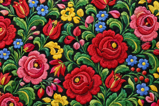Matyo embroidery with satin-stitch roses on black, folk costume