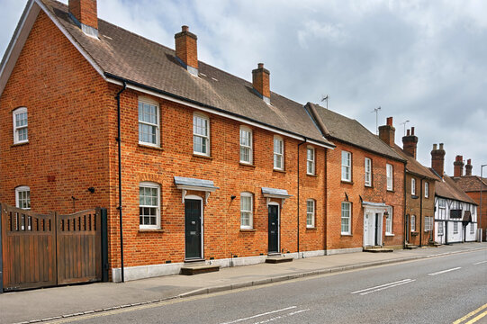 Traditional red-brick houses along Aylesbury End in Beaconsfield Old Town, Buckinghamshire, England