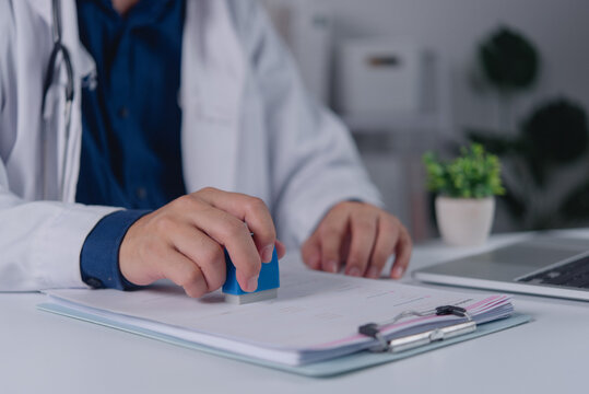 Doctor Stamping Medical Documents for Healthcare Administration