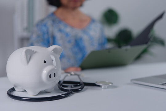 Healthcare Savings Concept with Piggy Bank and Medical Stethoscope