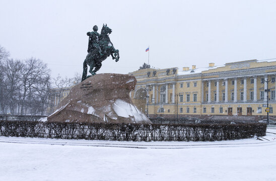 St. Petersburg in winter. Equestrian statue of Peter I in Senate Square, known as Bronze Horseman, on snowy December day. Sculptor E.M. Falconet, 1782. View of historic Senate and Synod buildings,1834