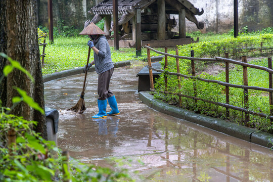 Vietnamese Worker Sweeping