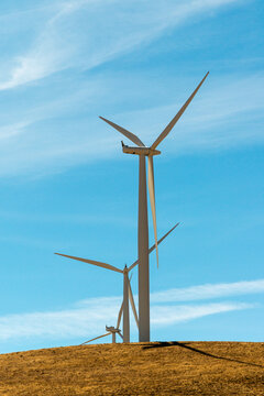 USA, South Central Washington.  A pair of wind turbines.