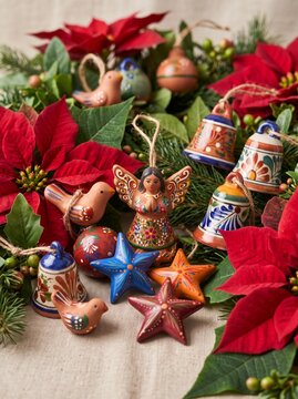 Colorful decorative Christmas ornaments with red poinsettias  