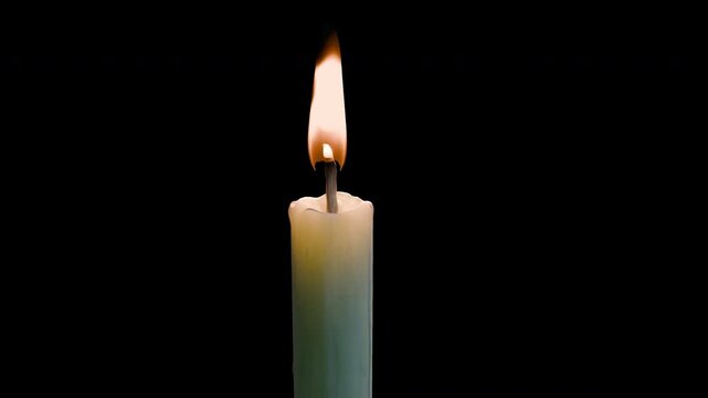 Candle flame isolated on alpha channel for professional video editing. This high-quality 4K footage features a realistic, glowing wick burning with cinematic warmth