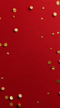 Red velvet surface with scattered fine gold confetti creates rich festive background with elegant texture and warm holiday appeal