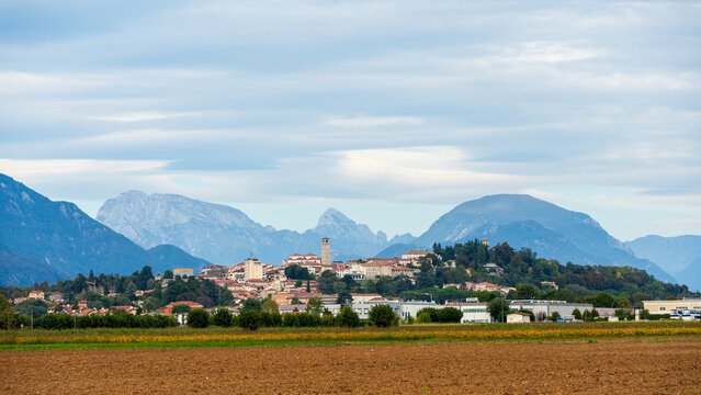 panorama of the town of San Daniele del Friuli, located on the hills of Friuli-Venezia Giulia with the Julian Prealps in the background. Italy