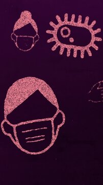 Vertical video: Camera panning vertically to reveal repeating print, showing virus, masks, soap