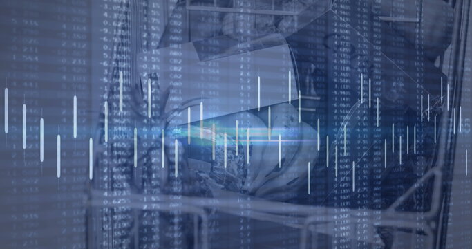 Analyzing financial data on computer screen with stock market graphs overlay