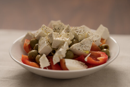 Greek style salad with tomatoes, bell pepper, olives and feta cheese
