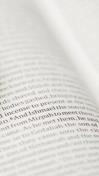 Vertical video: Camera focusing, page drifting, brass compass entering and settling, guiding eye