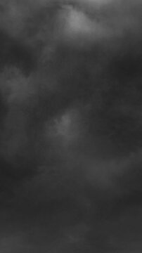 Vertical video: Shifting winds pushing cloud mass, dark pockets spreading, signaling storm