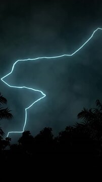 Vertical video: Faint blue glow sparking bolt, storm sky flashing lightning, revealing treeline