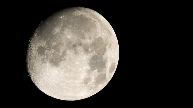 Moon with detailed craters and lunar surface in black sky