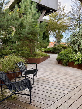 Modern Wooden Terrace with Garden Planters and Outdoor Seating
