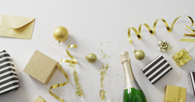 Decorations and champagne on white background at new year's eve
