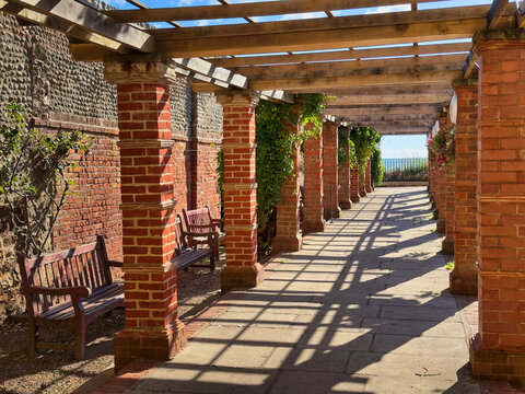 Red Brick Pergola Walkway and Stone Archway in Connaught Gardens, Sidmouth, Devon