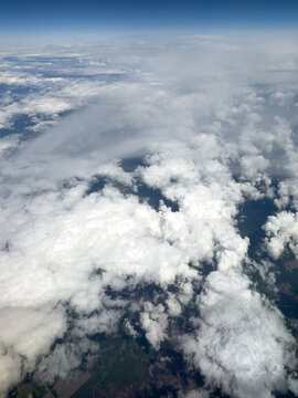 High-altitude view of clouds from airplane window