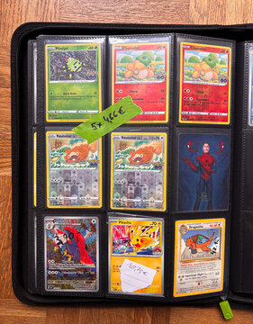 Hamburg, Germany - 24102026: French Pokemon GO Unpeeled Ditto Cards in Trading Card Binder with Pikachu and Dragonite.
