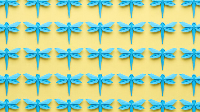 Seamless Blue Paper Dragonfly Grid on Yellow