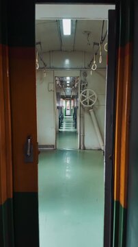 vintage train wagon interior with perspective view, retro carriage in classic design and cozy aged ambiance, 4k vertical video