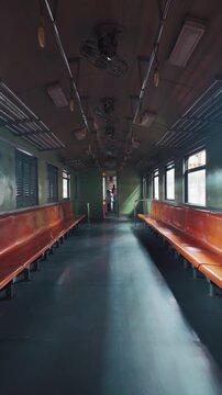 vintage train wagon interior with perspective view, retro carriage in classic design and cozy aged ambiance, 4k vertical video