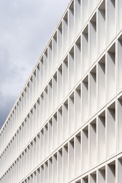 Minimal white facade with repeating geometric pattern