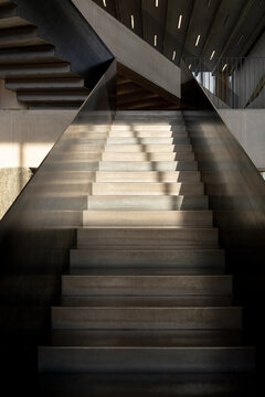 Sunlight and shadows on modern concrete staircase