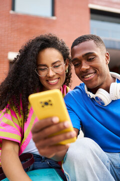 Young friends enjoying shared content on a smartphone