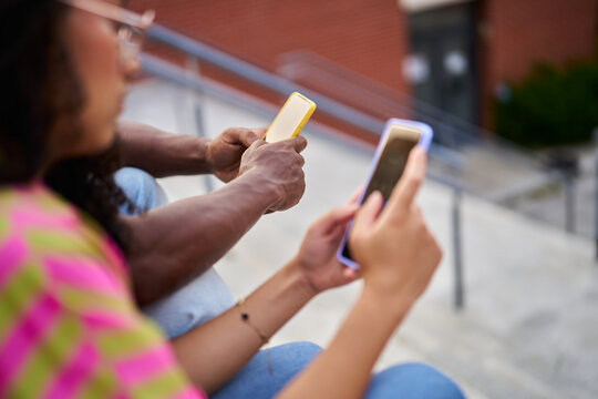 People focusing on smartphones ignoring their surroundings