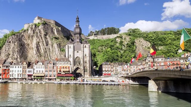 Zoom out from Dinant citadel cliff to riverfront and bridge