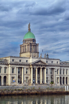 Custom House in Dublin Ireland central part. Neoclassical architecture facade with a majestic dome under daytime sky