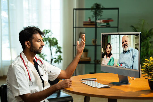 Young Indian Male Doctor Providing Telemedicine Consultation from Clinic