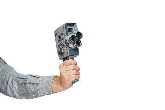 A hand holding retro film camera. Vintage cinema poster.