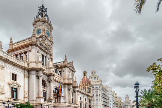 Valencia, Spain - Grandiose neoclassical facade of the Ayuntamiento de Valencia (City Hall) in the main square. Historic Spanish architecture landmark in downtown on  cloudy day.