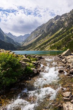 Outlet of the Lac de Gaube, the Gave de Gaube torrent, rushing down the valley towards the Cascade du Pont d&rsquo;Espagne, Parc National des Pyr&eacute;n&eacute;es, Cauterets, summer