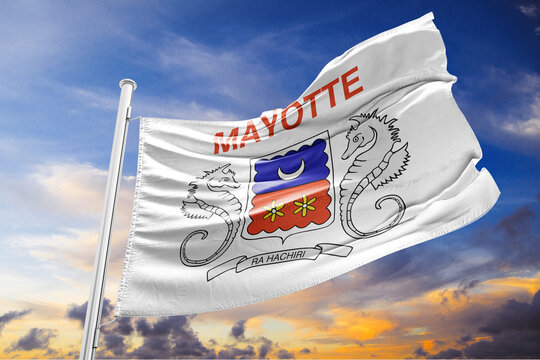 Flag of Mayotte Waving in the Wind against a Sunset Sky