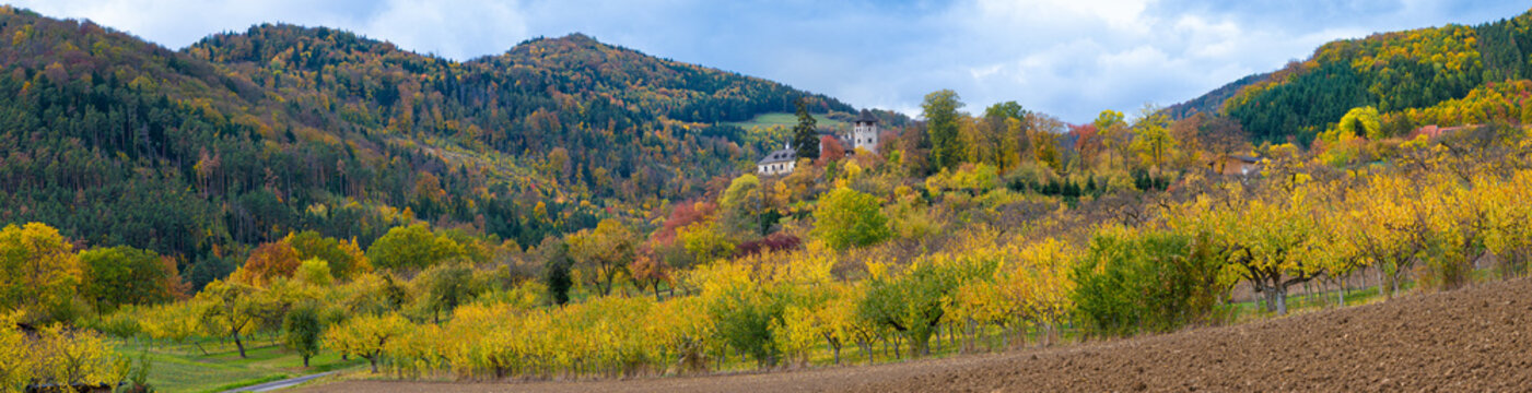 Panoramic autumn view of medieval Oberranna castle nestled in colorful hills of Spitzer Graben Wachau Austria