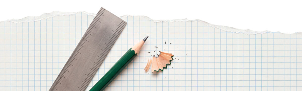Torn grid notebook paper with ruler and pencil on transparent background