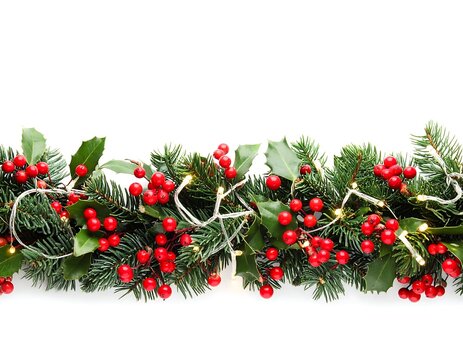 Christmas Garland with Red Berries and Lights on White Background