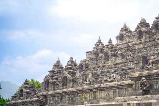 Wide Borobudur Temple Facade Under Cloudy Sky