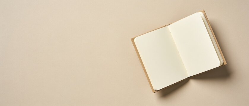 Minimalist open notebook on neutral background with soft natural lighting