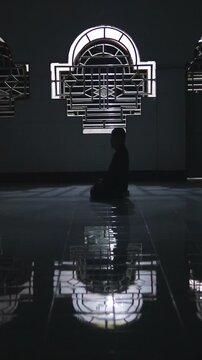 Silhouette of Person Praying in Mosque
