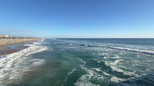 View of Large Ocean Waves at Huntington Beach California in Late Afternoon