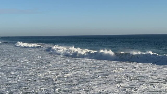 View of Large Ocean Waves at Huntington Beach California in Late Afternoon
