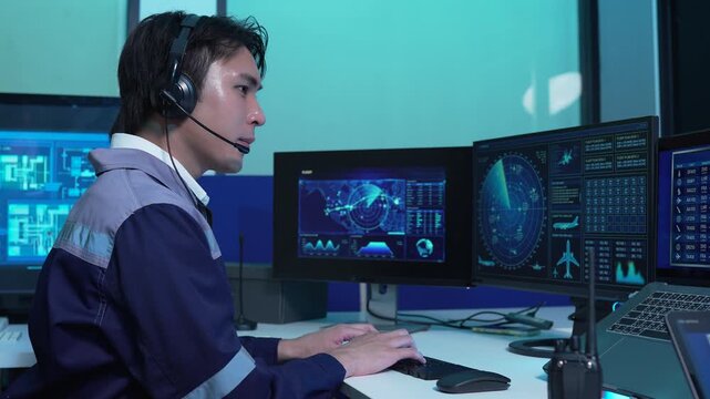 engineer logistics operator using GPS radar and real-time fleet management dashboard on computer.
