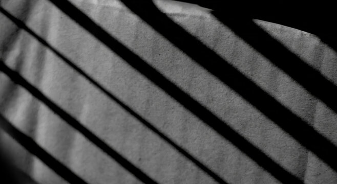Light from the window and shadows on the concrete wall