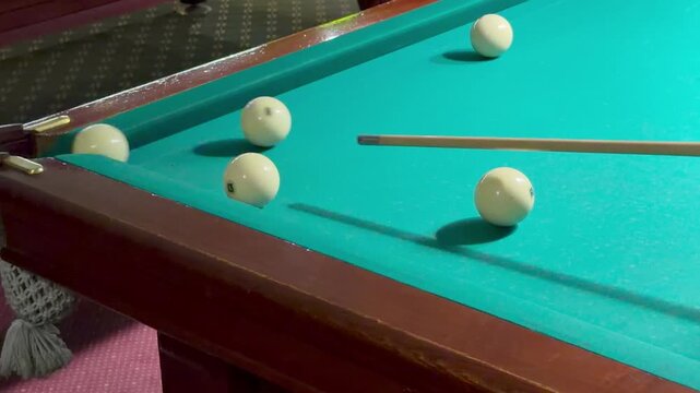Successful strike sends white Russian billiard ball straight into corner net pocket, slow motion. Professional cue sport game process, precise execution strategy, green felt table cloth.