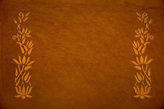 Rangoli border on grunge mud ground. Template with empty space for text. Indian religious motifs and background.