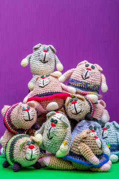 Crocheted cats on a colorful background